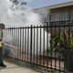 A Miami-Dade County mosquito control worker sprays around a home in the Wynwood area of Miami on Monday, Aug. 1, 2016. Photo via AP